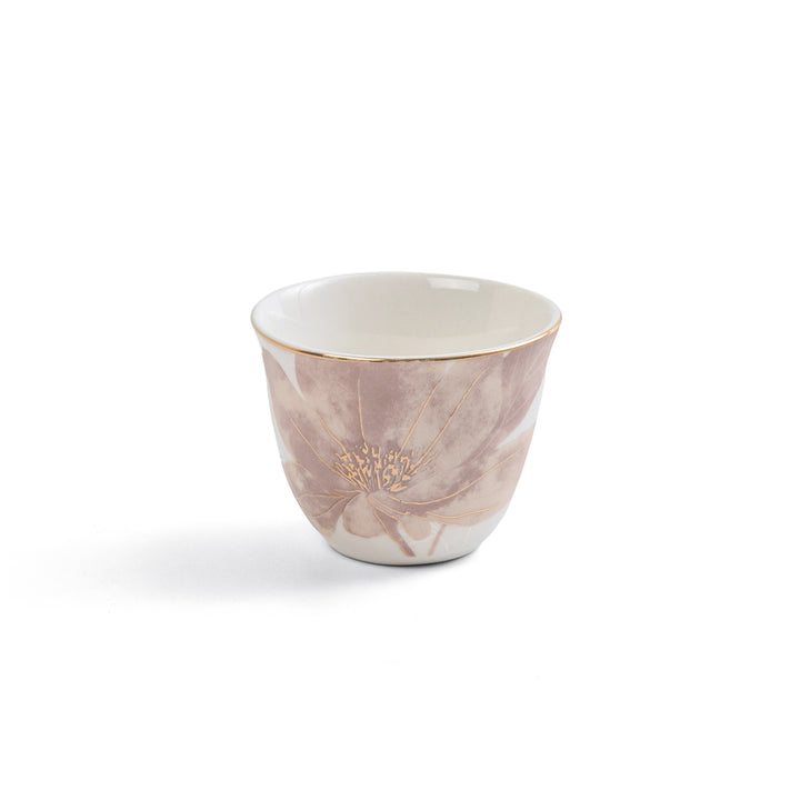 Marble-patterned ceramic cup with gold accents on a white background