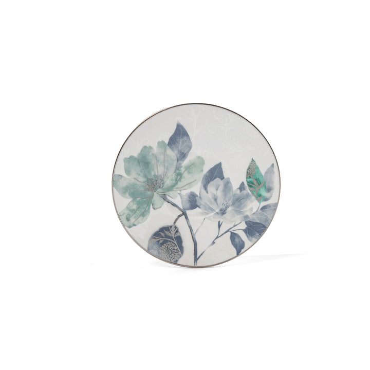 Round ceramic plate with floral design on a white background