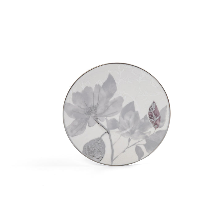 Round ceramic plate with floral design on a white background