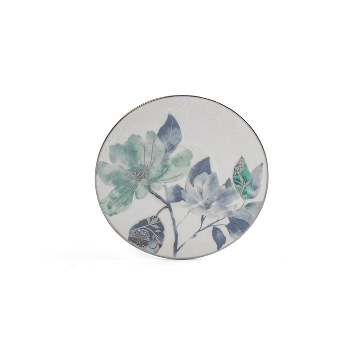 Round ceramic coaster with floral design on a white background
