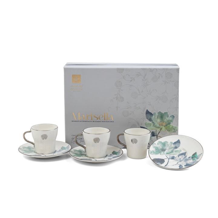 Set of ceramic tea cups and saucers with floral design, featuring a Mantisella branded box.