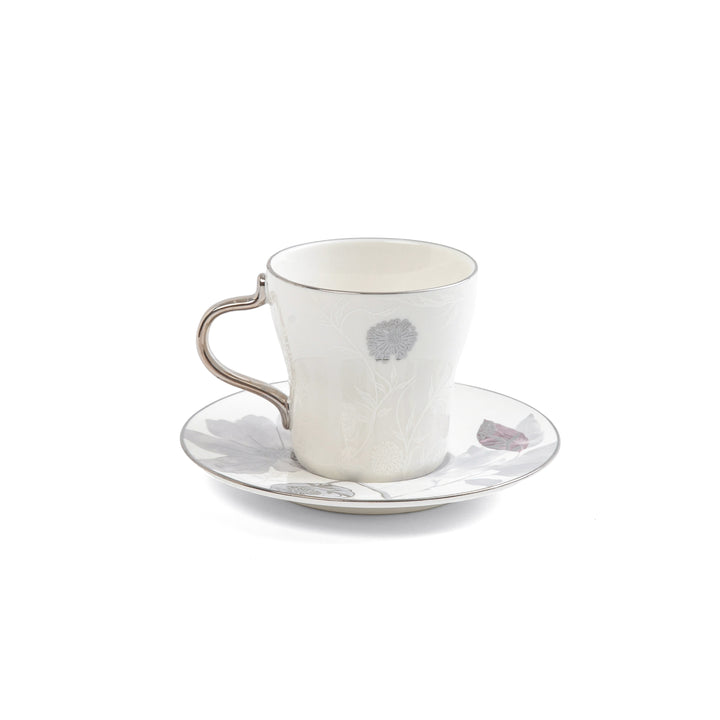 White ceramic cup and saucer with subtle design on a white background