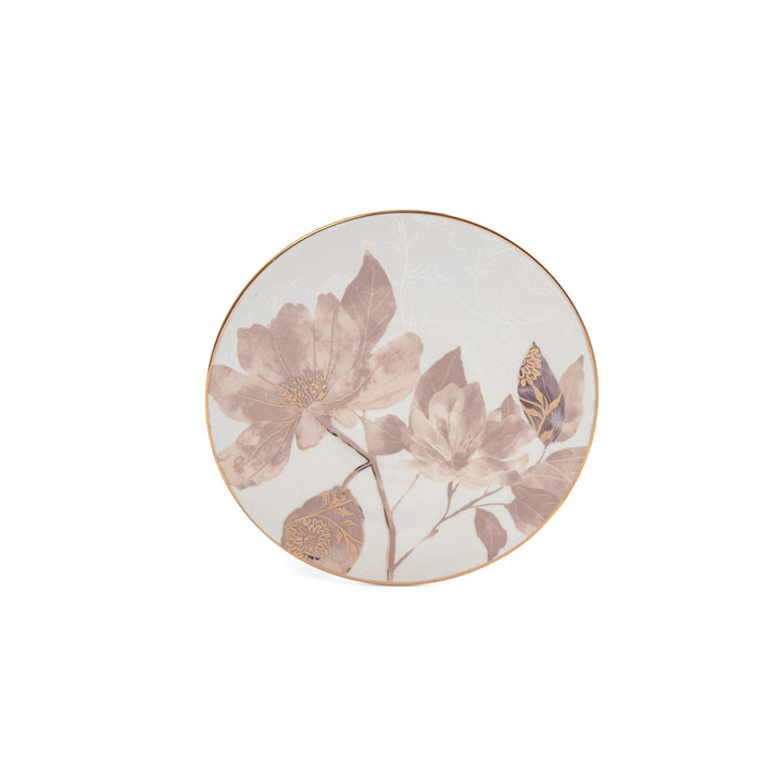 Round ceramic plate with floral design on a white background