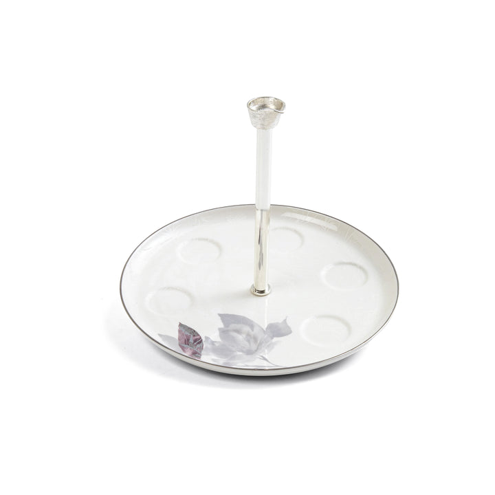 Silver ring holder with butterfly design on a white background