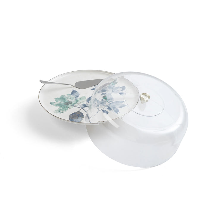 Round white container with floral lid on a white background