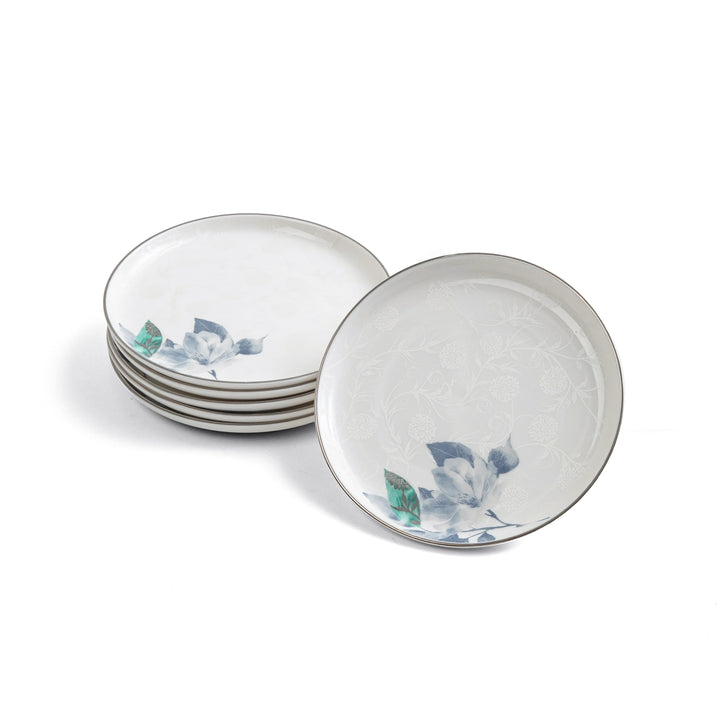 Set of ceramic plates with floral design on a white background