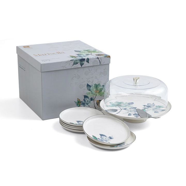 Set of ceramic dishes with floral patterns in a decorative box on a white background