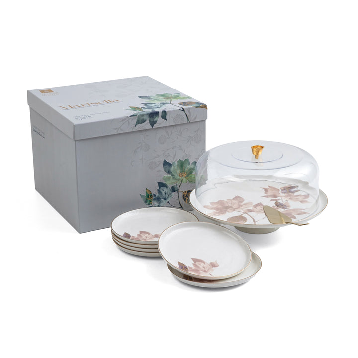 Set of ceramic dishes with floral design and a matching box on a white background