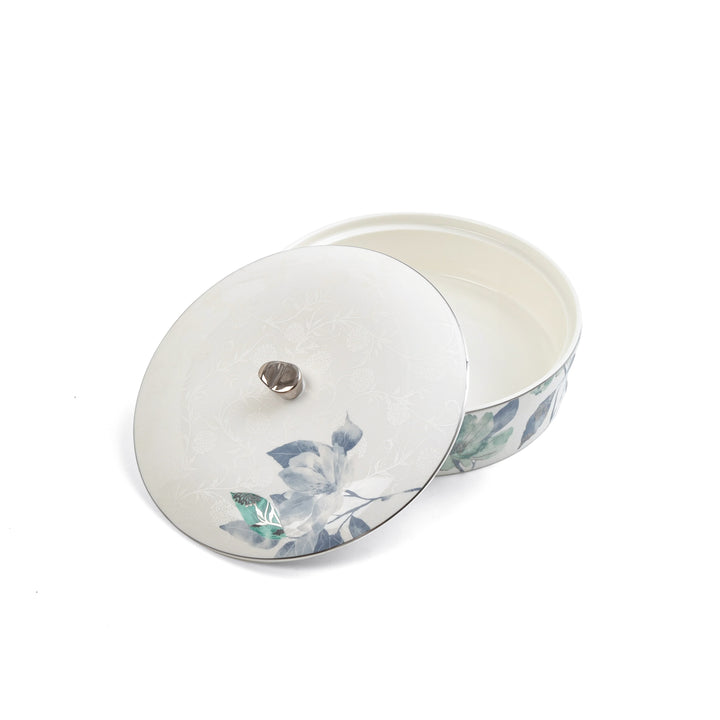 Round ceramic container with floral design on a white background