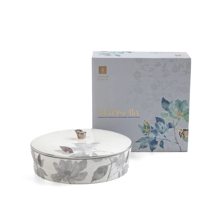 Floral-patterned ceramic dish with lid and matching packaging on a white background
