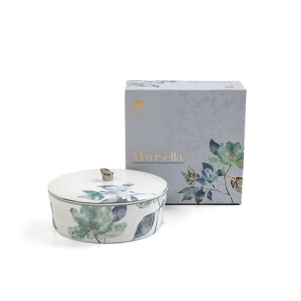 Decorative ceramic container with floral design and matching box on a white background