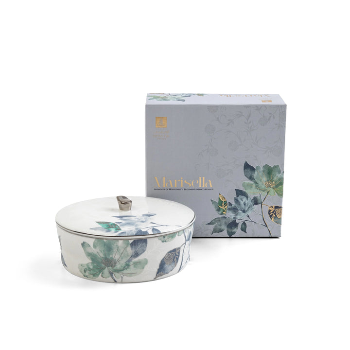 Decorative ceramic container with floral design and matching box on a white background