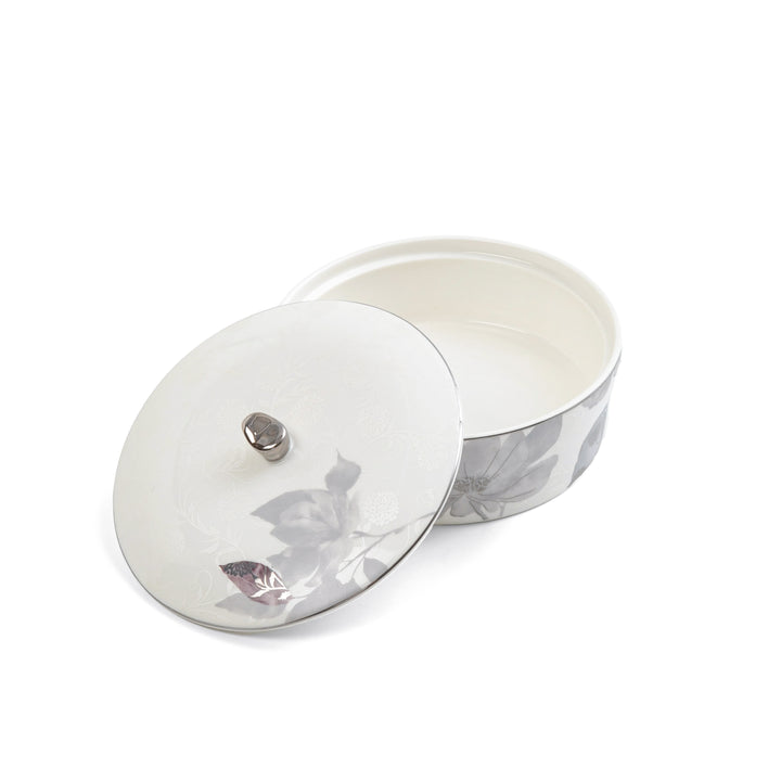Glass lid with a metal handle on a white background