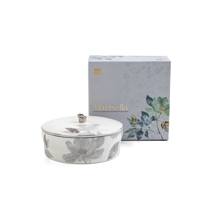 Decorative bowl with lid and packaging featuring floral design on a white background