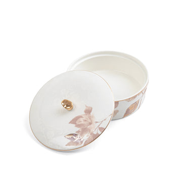Decorative ceramic jar with floral design on a white background