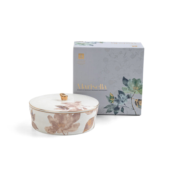 Decorative ceramic container with floral design and matching box on a white background
