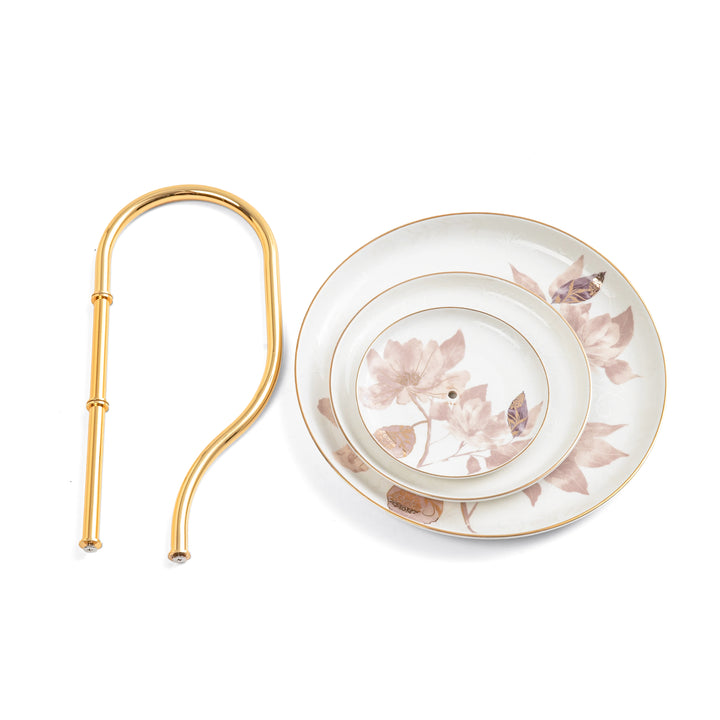 Tea strainer with floral design on a white background