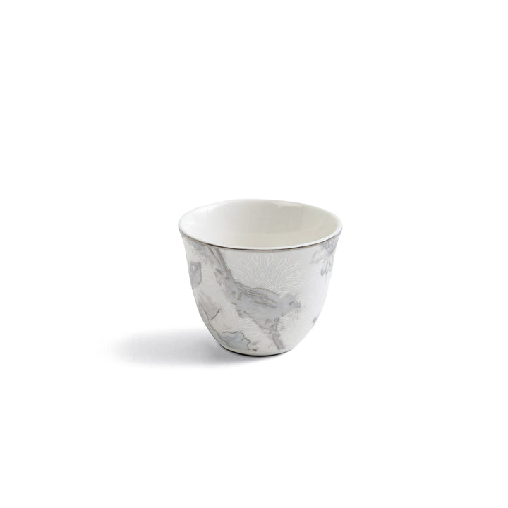 Marble-patterned ceramic cup on a white background