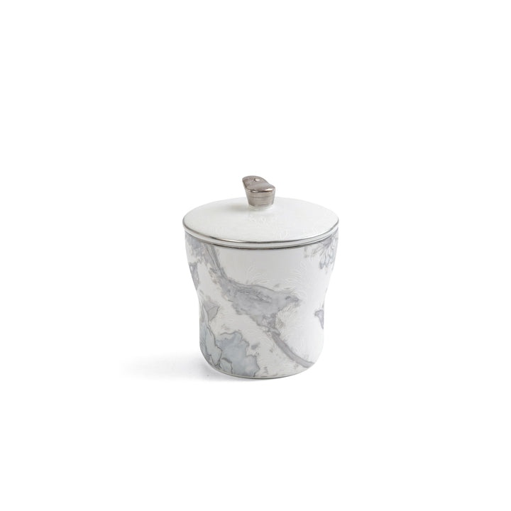 Marble-patterned jar with a lid on a white background