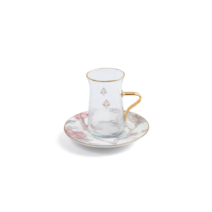 Teacup and saucer set with floral design on a white background