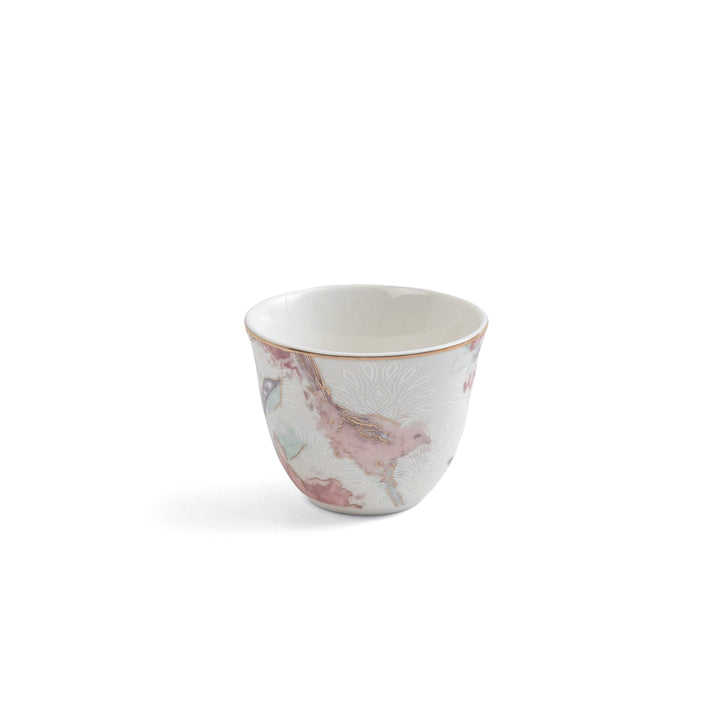 White ceramic cup with pink and gray marbled pattern on a white background