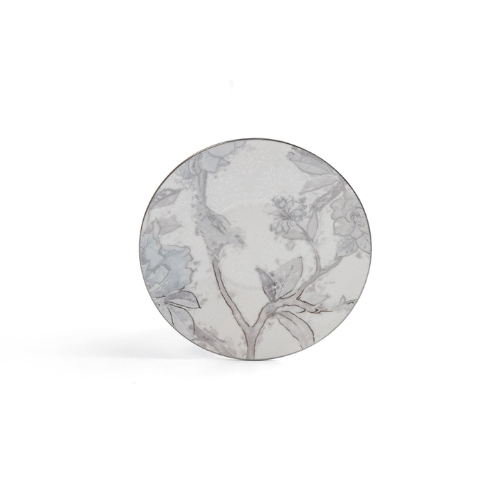 Round marble coaster with floral design on a white background