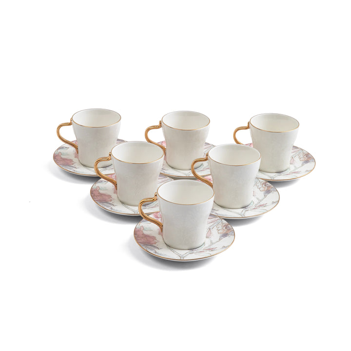 Set of six white cups with gold handles and saucers on a white background