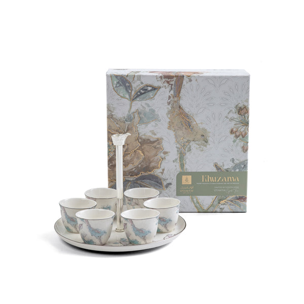 Ceramic cup set with stand and decorative box on a white background