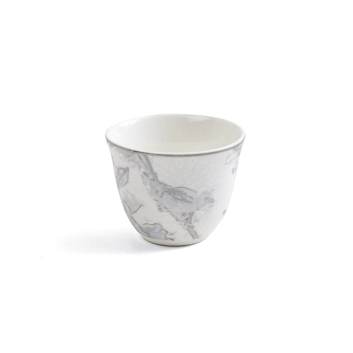 Marble-patterned ceramic cup on a white background
