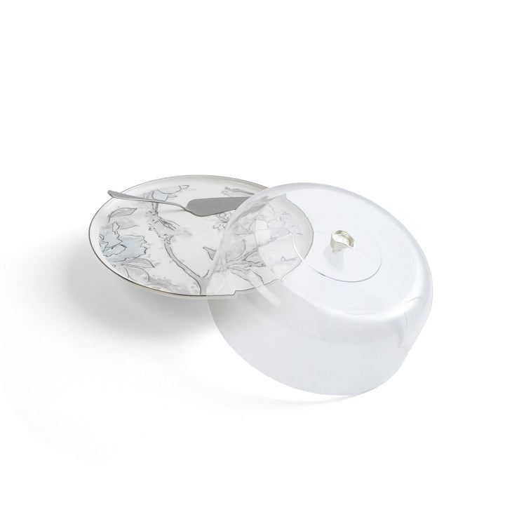 White ceramic plate with floral design on a white background