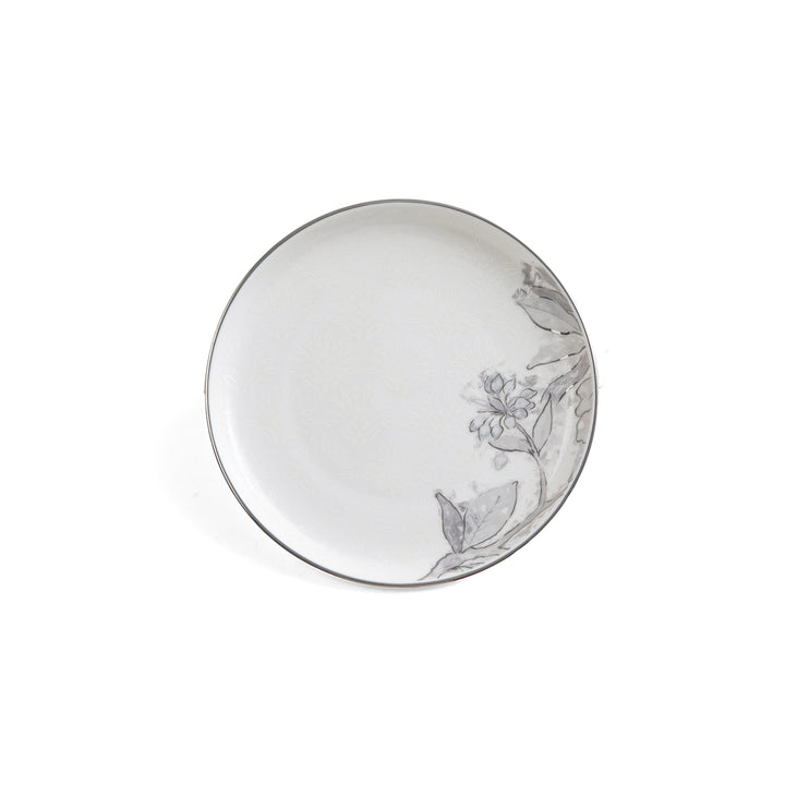 Decorative ceramic plate with floral design on a white background