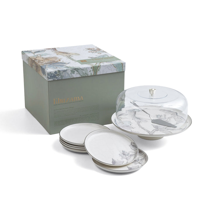 Set of marble-patterned ceramic plates with a lid and a branded box on a white background