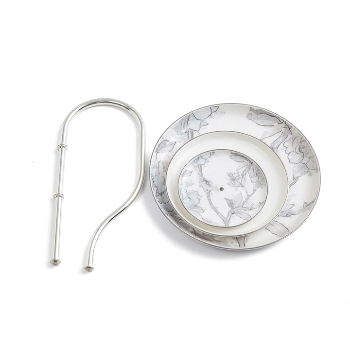 Silver earring with floral design on a white background