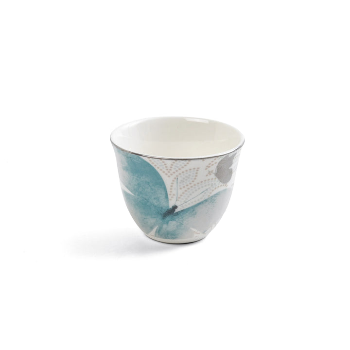 Ceramic cup with blue and gray design on a white background