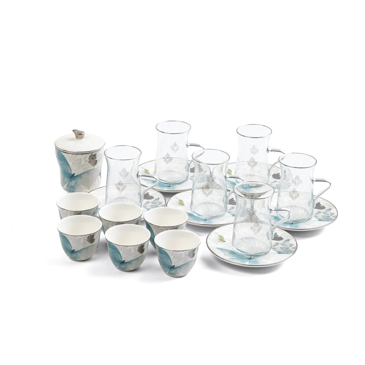 Ceramic tea set with cups, saucers, and a teapot on a white background