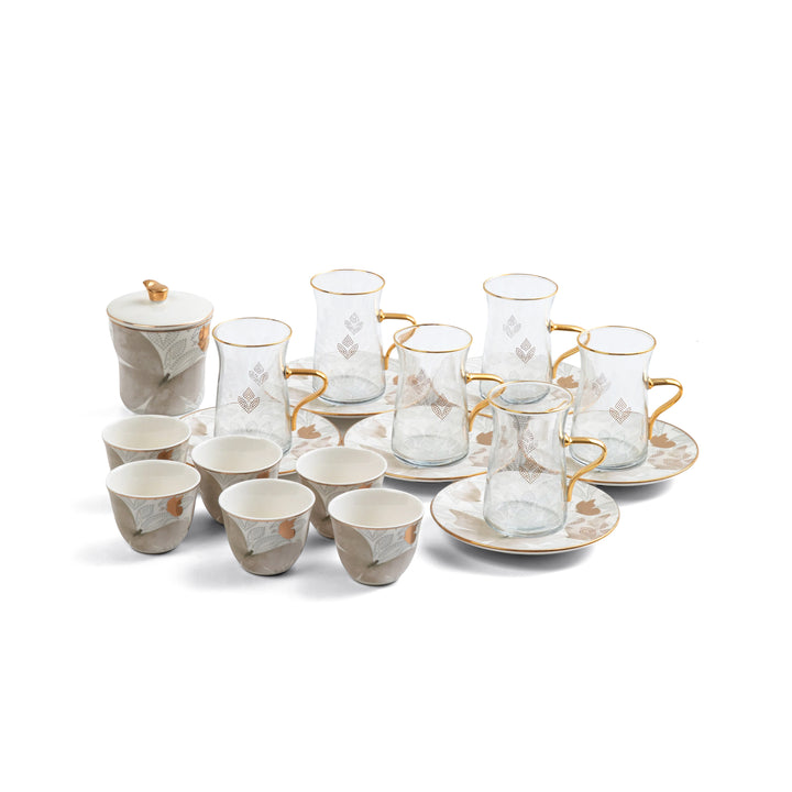 Tea set with cups, saucers, and teacups on a white background