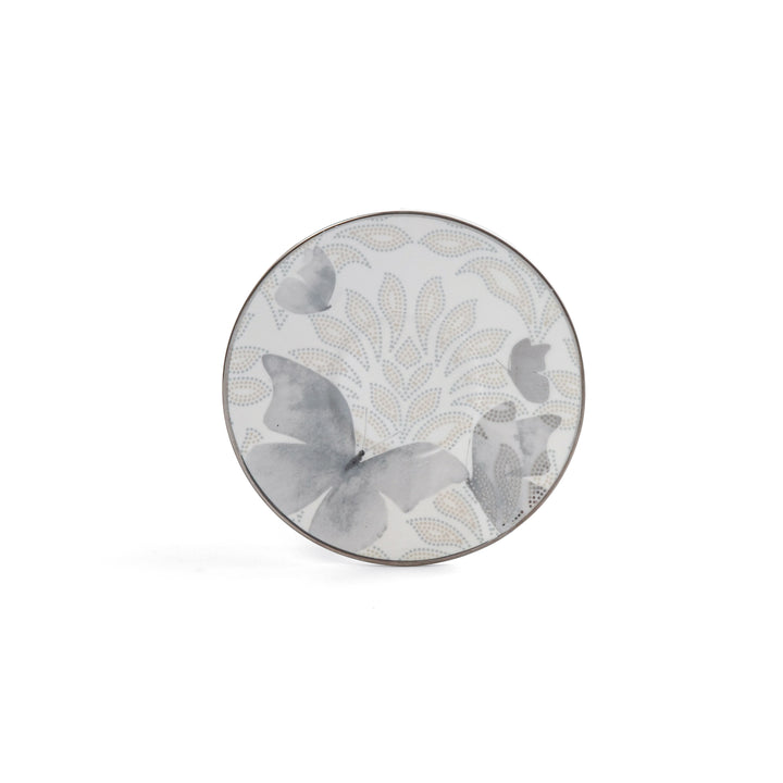 Round decorative plate with floral pattern on a white background