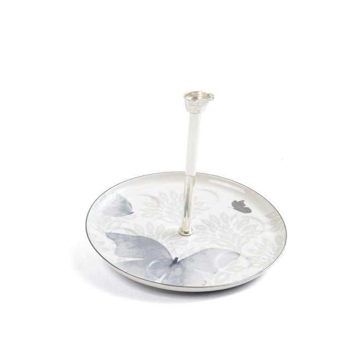 Silver ring holder with butterfly design on a white background