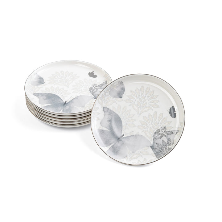 Set of round ceramic plates with floral patterns on a white background