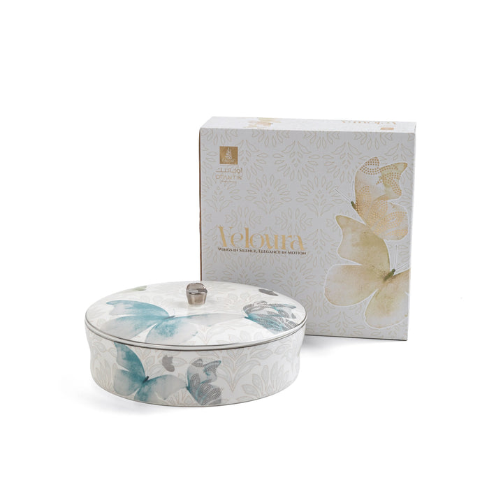 Decorative tin with butterfly design and matching box on a white background