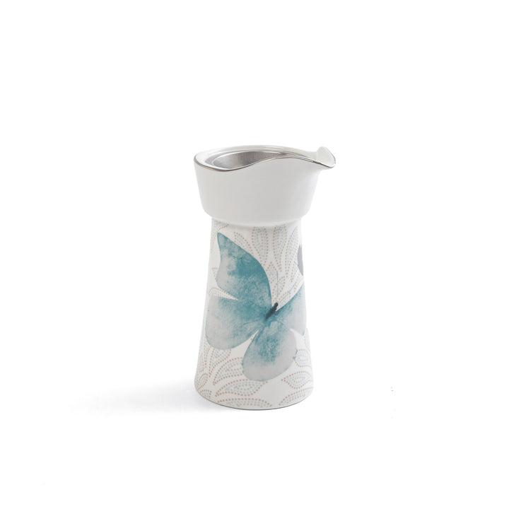 Ceramic pitcher with butterfly design on a white background