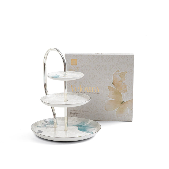 Three-tiered ceramic tray with floral design on a white background, featuring a branded box.