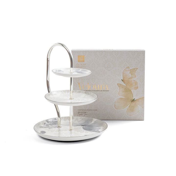 Two-tiered silver tray with a box featuring butterfly design on a white background