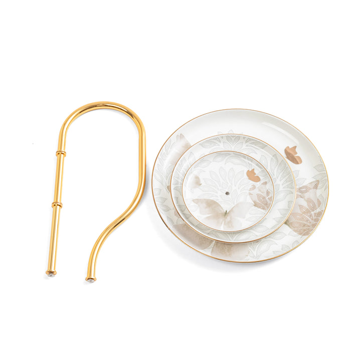 Set of white ceramic plates with gold accents on a white background