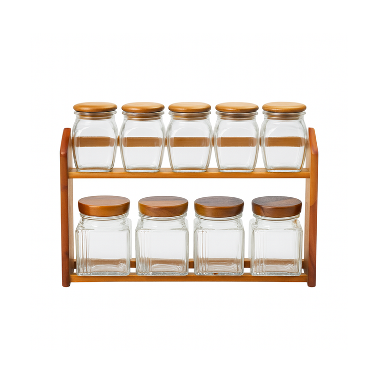 Set of glass jars with wooden lids on a wooden shelf against a white background
