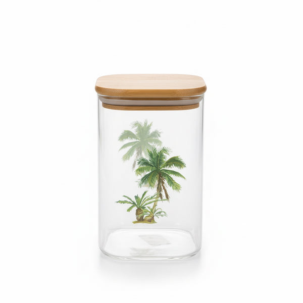 Clear glass jar with a wooden lid featuring palm tree designs on a white background