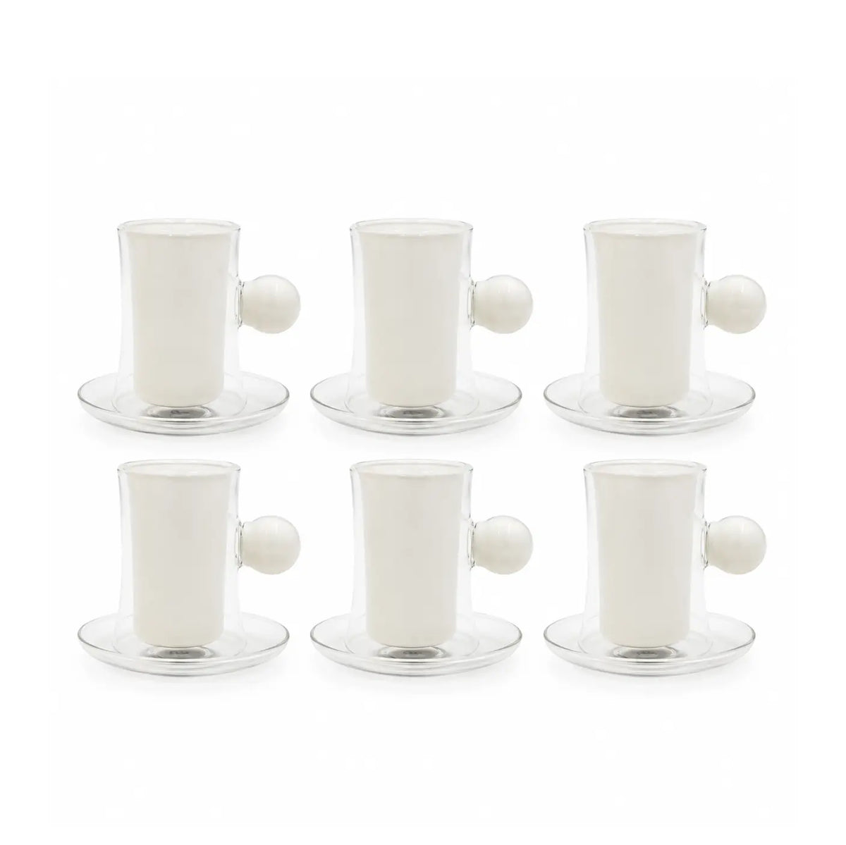 A clear glass coffee maker set with a white ceramic inner cup and saucer, a matching small white cup with a black clover logo, and a white spherical handle, photographed on a white background.