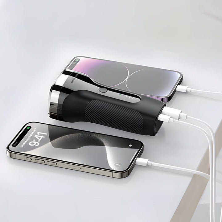 Two smartphones being charged by a power bank on a white surface