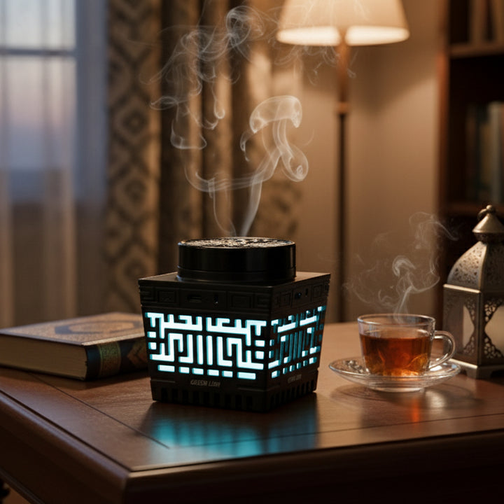 Decorative lamp with glowing pattern on a table next to a cup of tea