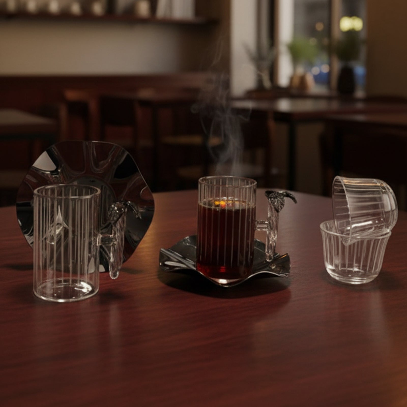 Tea set with a teapot, cups, and a tray on a wooden table in a cozy room.